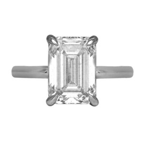 white gold solitaire engagement ring centered with an emerald cut diamond