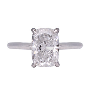 white gold solitaire engagement ring set with an elongated cushion diamond