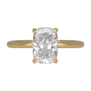 yellow gold solitaire engagement ring set with an elongated cushion diamond