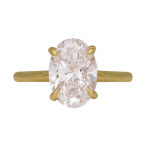 yellow gold solitaire engagement ring set with an oval diamond
