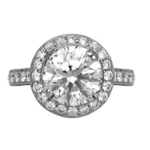 white gold halo engagement ring centered with a large round diamond with round diamonds in the halo and band