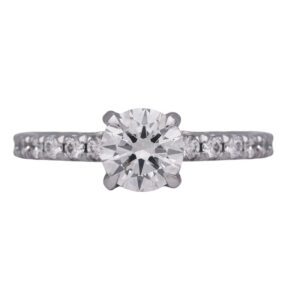 white gold underhalo engagement ring centered with a round diamond surrounded by round diamonds in the band