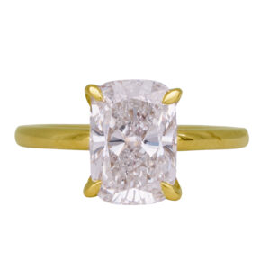yellow gold under-halo engagement ring centered with a cushion diamond and round brilliant diamond under-halo