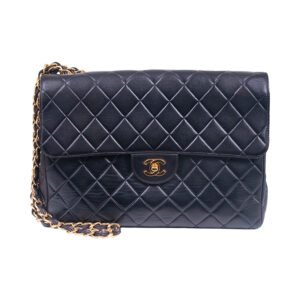black embossed leather chanel handbag with gold tone shoulder strap