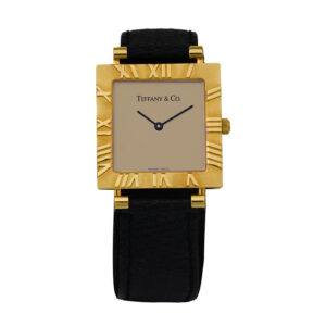 yellow gold square Tiffany watch with a gold dial, Roman numeral bezel, and black leather strap