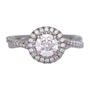 platinum halo engagement ring set with round diamonds and a twisted band