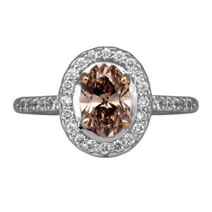 white gold halo engagement ring centered with an oval champagne diamond surrounded by round diamonds in the halo & band