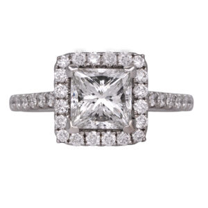 white gold halo engagement ring centered with a princess diamond surrounded by round diamonds in the halo and band