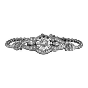 Vintage platinum bracelet set with 3.79 carats of round brilliant, old European cut, marquise, and baguette earth-mined diamonds with a safety chain.