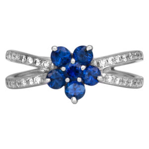 white gold split shank ring set with round brilliant blue sapphires as a flower, with round diamonds in the band