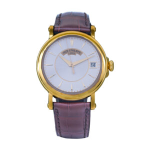 yellow gold watch with a silver dial and brown leather strap