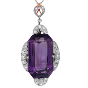 platinum pendant set with a large emerald cut amethyst surrounded by round diamonds