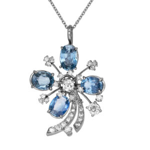 antique platinum pendant set with blue sapphires and diamonds