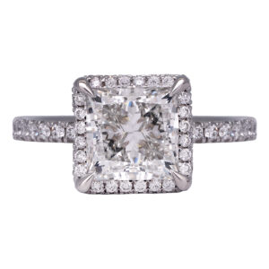 white gold halo engagement ring centered with a princess diamond surrounded by round diamonds