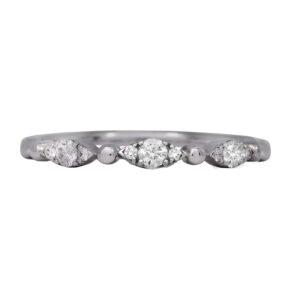 white gold band set with round diamonds