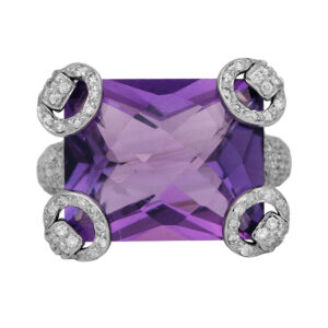white gold ring centered with a large checkerboard cushion amethyst with fancy horesbit prongs set with round diamonds
