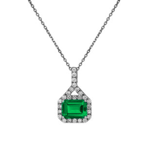 white gold east-west set emerald cut emerald surrounded by round brilliant diamonds