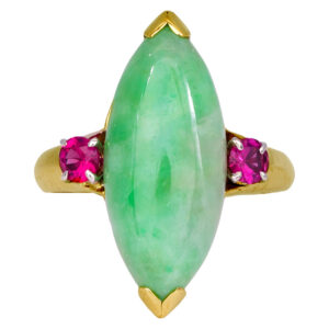 yellow gold ring with a long marquise cabochon jade flanked by round brilliant rubies