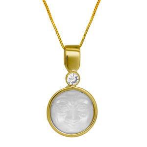 yellow gold pendant set with a carved "man in the moon" moonstone and a round brilliant diamond