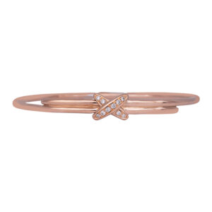 rose gold bangle bracelet set with round diamonds inside an X charm