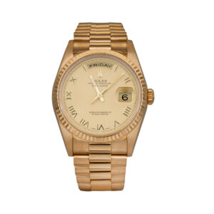 yellow gold Rolex with a champagne dial
