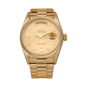 yellow gold Rolex with a gold diamond dial