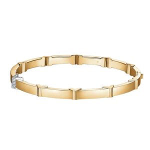 yellow gold bangle with station v notches, one of them set with paved diamonds