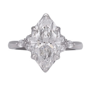 white gold ring centered with a marquise diamond flanked by