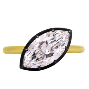yellow gold rand black rhodium solitaire engagement ring set with a 45 degree offset marquise diamond