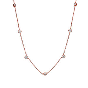 rose gold station necklace set with round diamonds