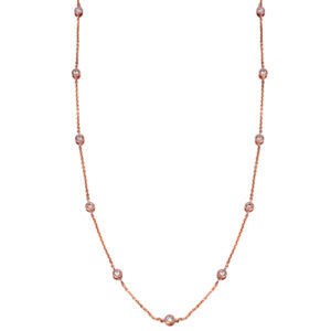 rose gold station necklace set with round diamonds