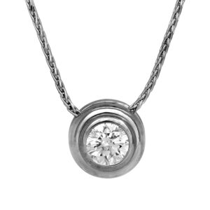 white gold solitaire pendant set with a round diamond