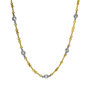 yellow and white gold "dog bone" necklace set with station round diamonds