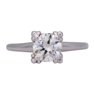 white gold solitaire engagement ring centered with a round "transition" cut diamond