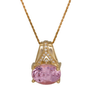 yellow gold pendant set with an oval morganite and small round diamonds