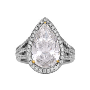 white gold halo engagement ring centered with a large pear diamond surrounded by round diamonds