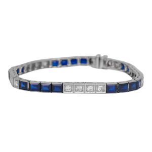 white gold tennis bracelet set with old European cut diamonds and blue princess sapphires