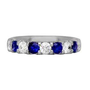 white gold band set with alternating round diamonds and blue sapphires