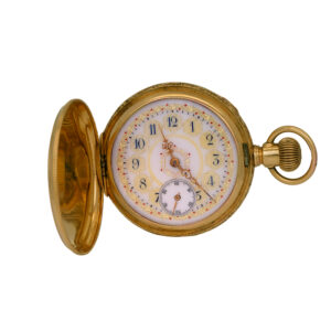 antique yellow gold pocket watch with white dial and gold and ruby details, shown open