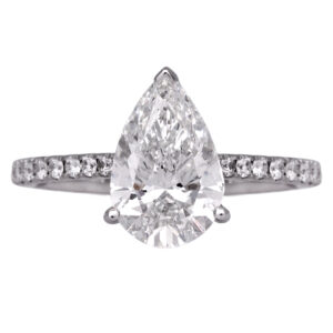 white gold engagement ring set with a large pear diamond and round diamonds in the band