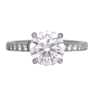 white gold engagement ring centered with a round diamond and round diamonds in the band