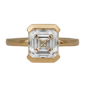 yellow gold solitaire engagement ring centered with an Asscher cut diamond