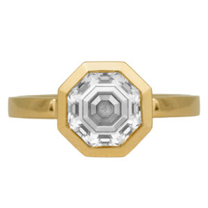 yellow gold solitaire engagement ring set with an octagon cut diamond