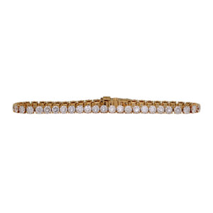 yellow gold tennis bracelet set with round diamonds