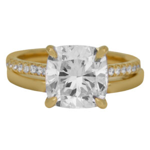 yellow gold engagement ring centered with a cushion diamond