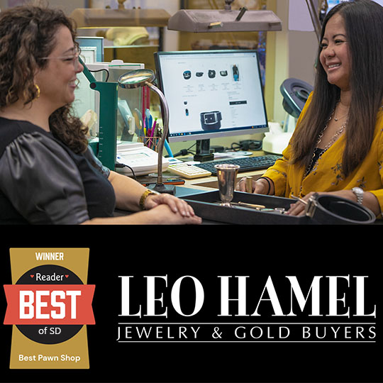 a photo of one of the Leo Hamel Jewelry Buying offices in which a Jewelry Buyer is assisting a customer.