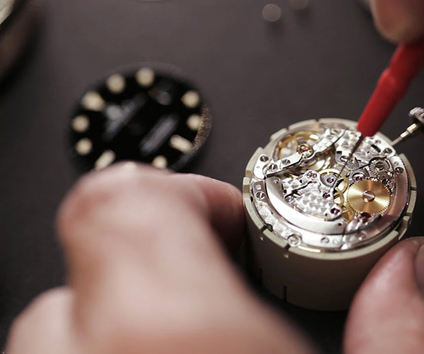 a close up image of a watch being serviced