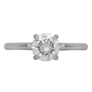 Vintage 18k white gold solitaire ring set with a 1.07 carat round brilliant earth-mined diamond.