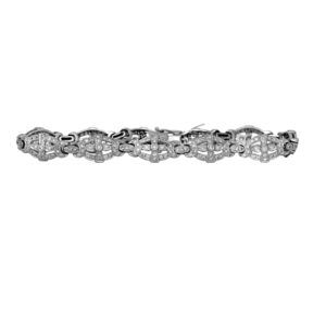 Vintage 18k white gold tennis bracelet set with 1.21 carats of round brilliant cut earth-mined diamonds.