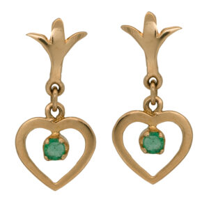 Vintage 14k yellow gold heart drop earrings set with 0.12 carats of round brilliant cut emeralds.